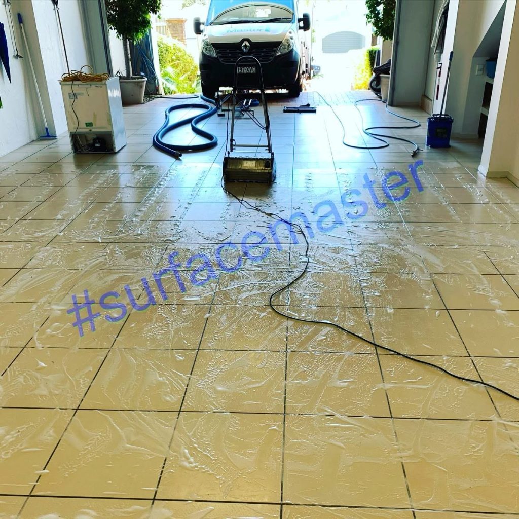 High-pressure clean on garage tiles